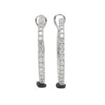 18K white gold diamond earrings, worn view