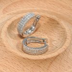 18K white gold diamond earrings, worn view